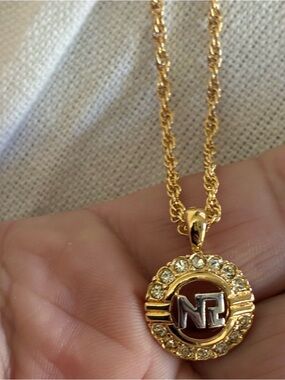 Nina Ricci Gold-Tone Crystal Round Pendant Necklace with Silver Initial Accent